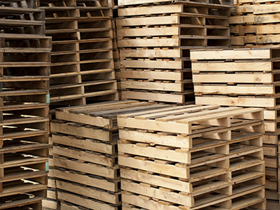 Orangeburg warehouse's stack of wood pallets for South Carolina industries