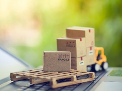 Mini Tractor, Pallet, and Boxes On Top of a Laptop in Indianapolis Indiana